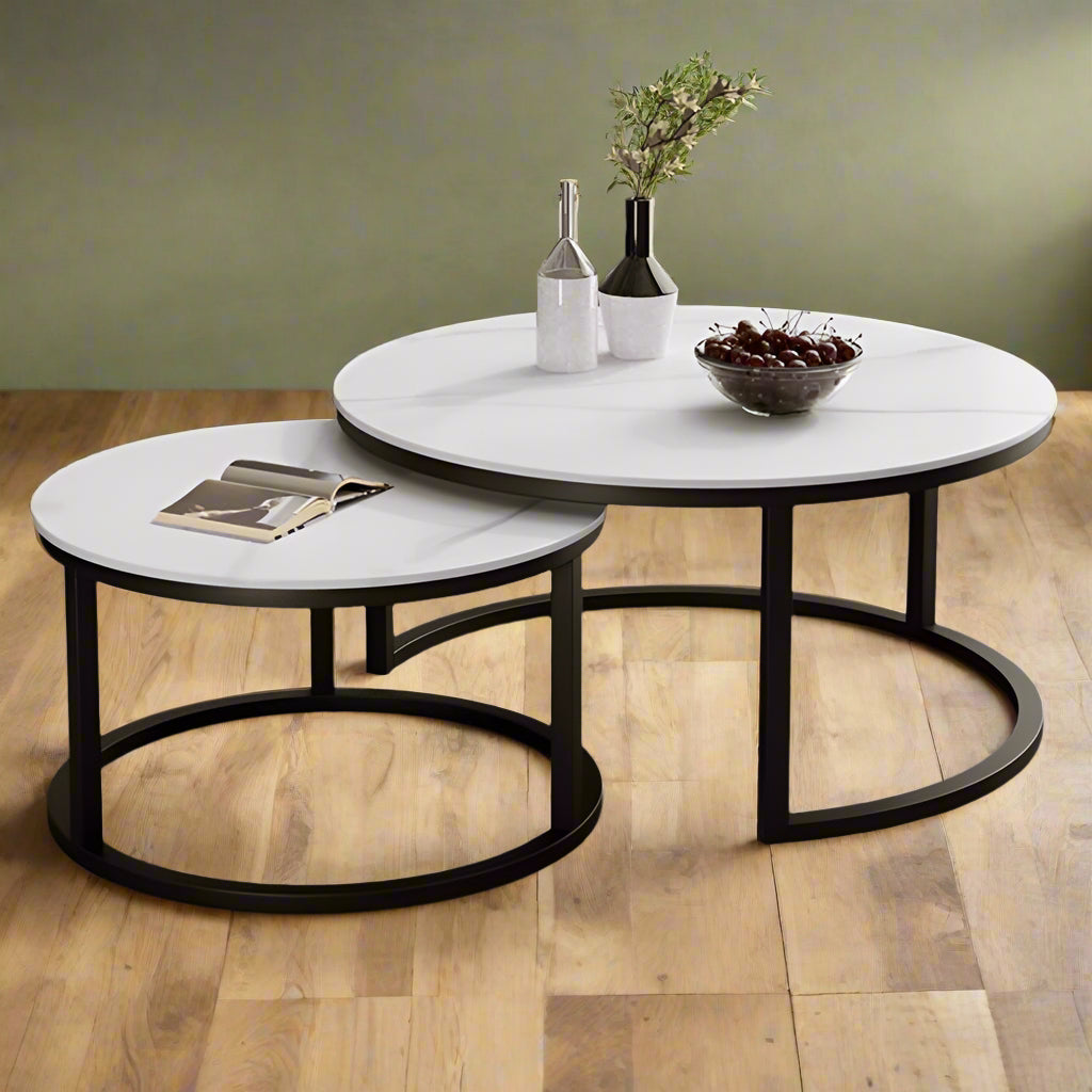 a couple of tables sitting on top of a carpeted floor